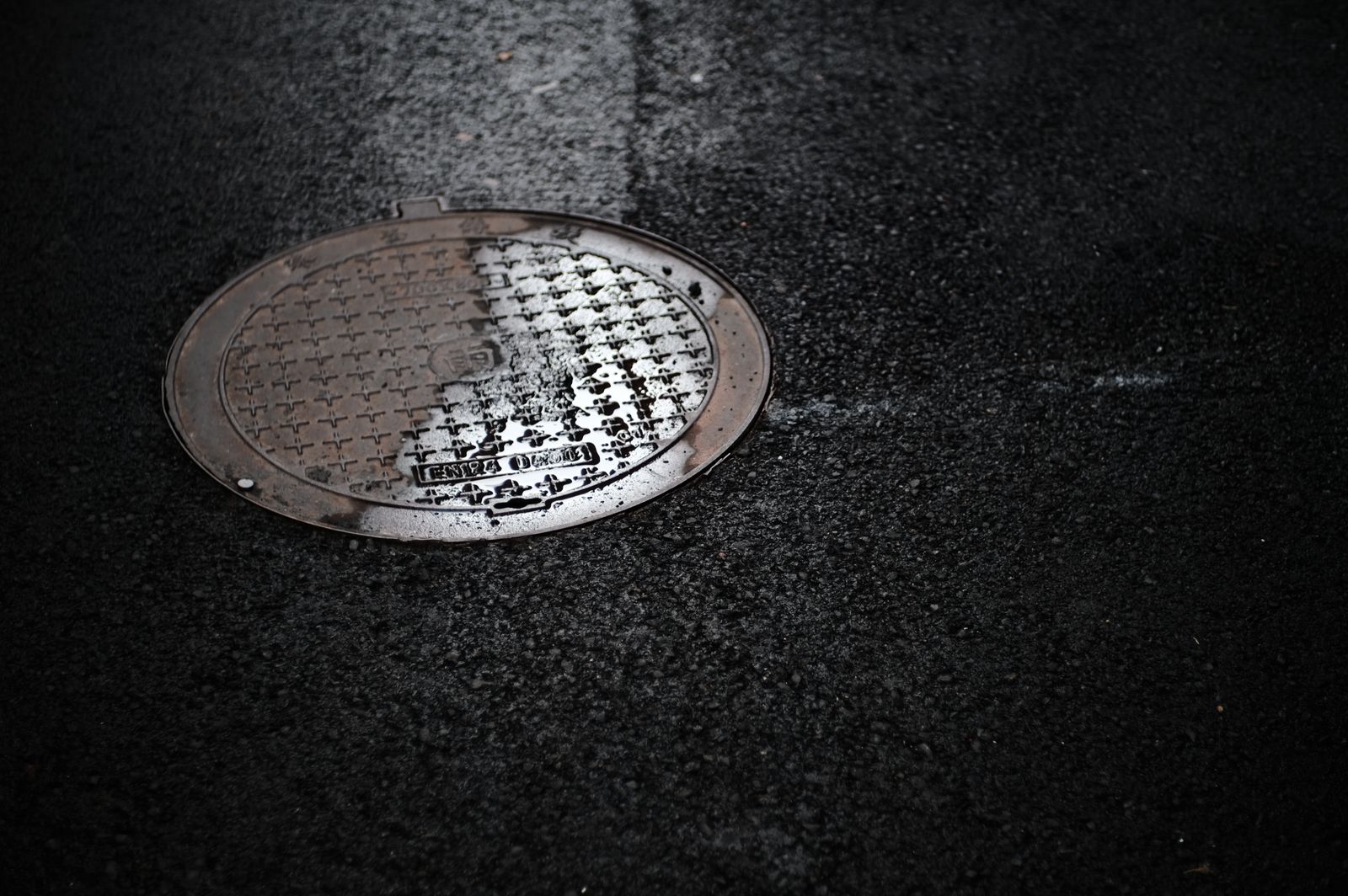 Sewer manhole access in a street